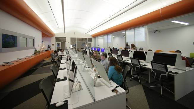 Patrons use computers at BiblioTech, a first of its kind digital public library, Wednesday, Dec. 11, 2013, in San Antonio. Bexar Countys BibiloTech is the nations only bookless public library, according to information gathered by the American Library Association, a distinction that has attracted scores of digital bookworms, plus emissaries from as far away as Hong Kong who want to learn about the idea and possibly take it home. (AP Photo/Eric Gay)